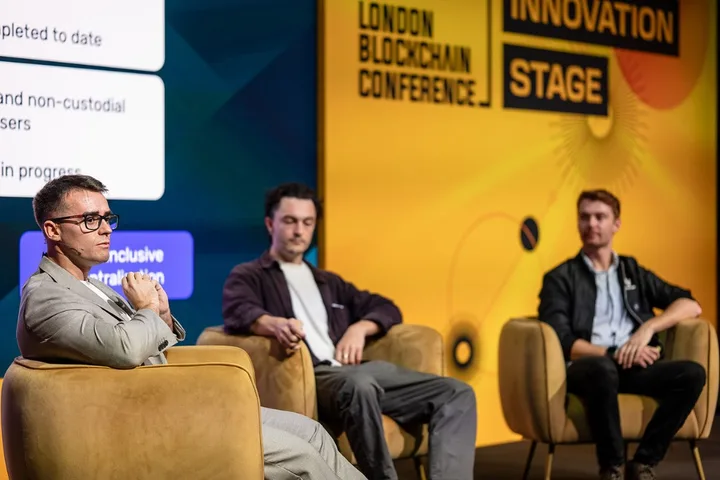 Dr Alec Burns on stage at the London Blockchain Conference